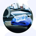 Water bottle and towel on a table with a blurred background