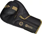 Black boxing glove with gold accents on a white background