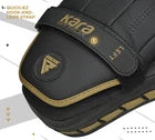 Black focus pad with gold accents on a white background