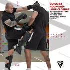 Two people practising martial arts using focus pads