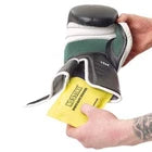 Yellow glove deodoriser placed inside a black boxing glove.