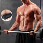 Man performing barbell curl using gym grips.