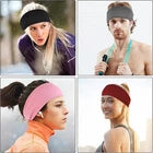 Four people wearing headbands in different colours.