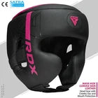 Black and pink RDX headguard on a grey background