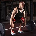 Man lifting weights wearing red knee wraps