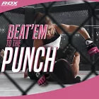 Woman competing at MMA wearing pink MMA gloves