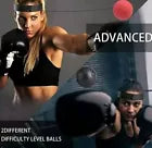 Woman training with reflex ball.