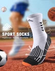 White sports socks with black stripes on a sports field background
