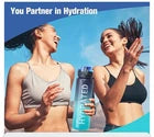 Two women by a pool with a water bottle, promoting hydration.