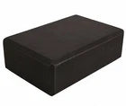 Black yoga block on a white background