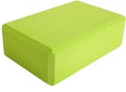 Green yoga block on a white background