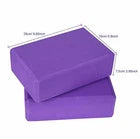 Purple yoga block with dimensions on a white background