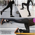 Person exercising with ankle straps.