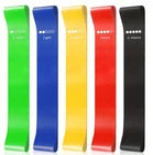 Set of resistance bands in red, orange, yellow, green, and blue on a white background