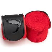 Red boxing hand wraps with black logo on a white background