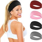 Woman wearing a black headband with colorful headbands displayed below.