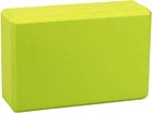Green foam yoga block on a white background