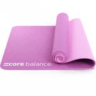 Purple yoga mat with 'Core Balance' branding on a white background